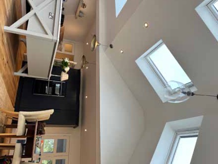 Kitchen with vaulted ceiling and skylights