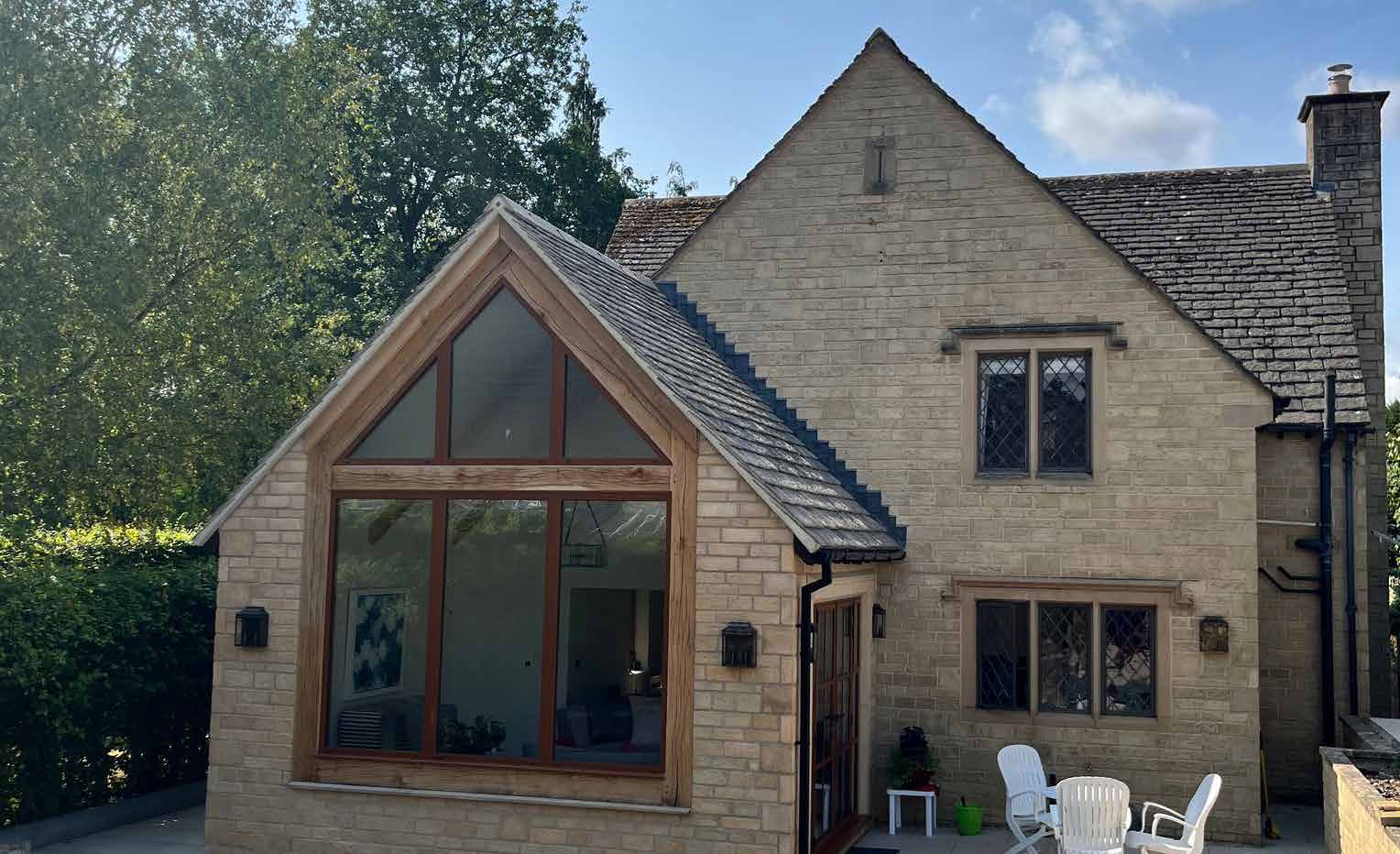 Oak frame extension on Cotswold stone property